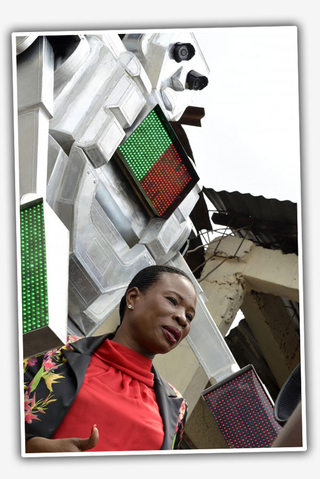 Illustration for article titled Woman Solves Traffic Problems In The Congo With A Giant Robot